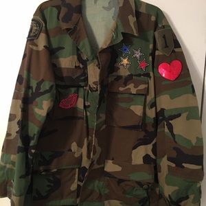 Camouflage jacket w/  patches. Sequined Rolling Stones patch on back.